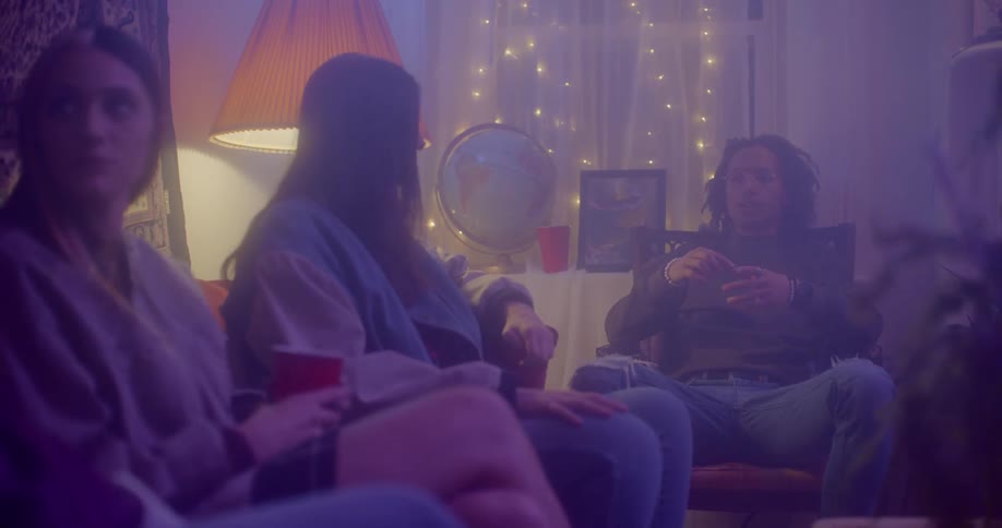 People are sitting in a room talking to each other