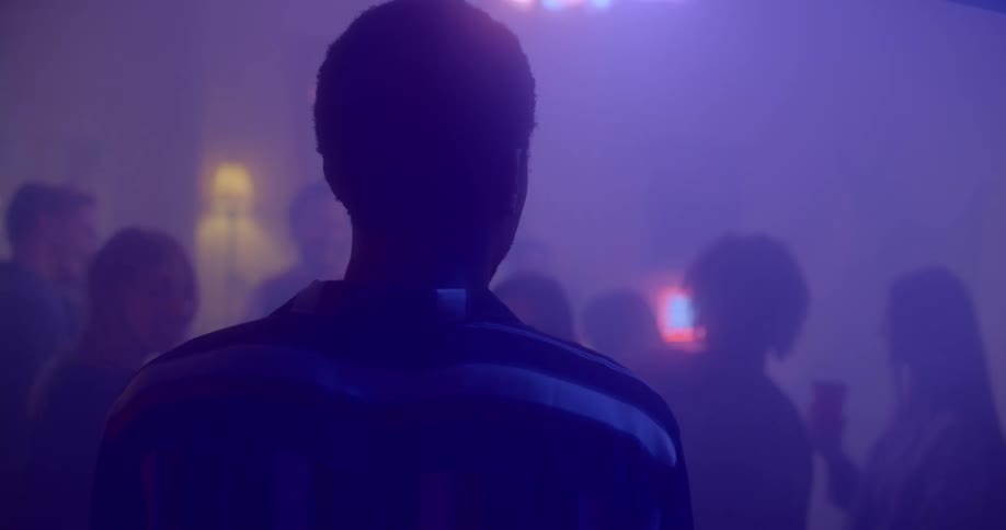 A person looks around a party