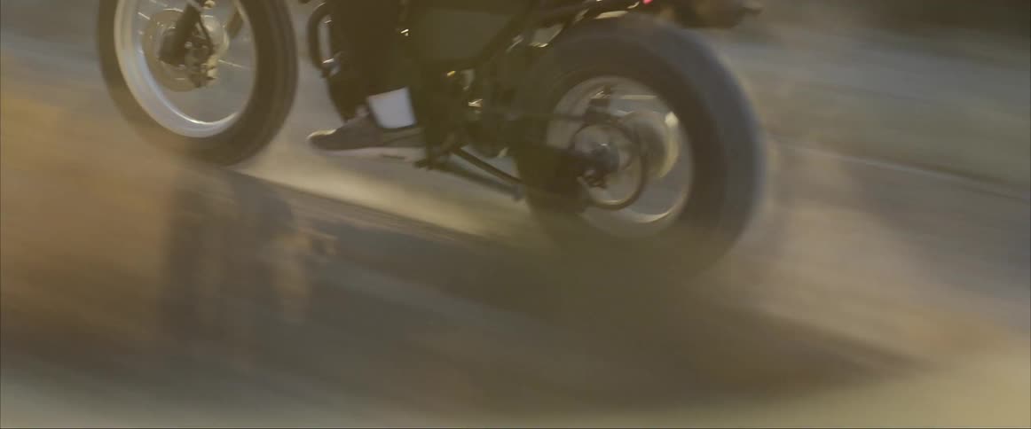 A person riding a motorcycle on a dirt road