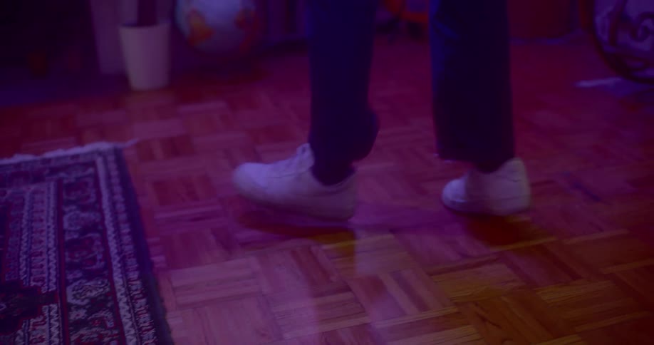 A person is dancing in a room