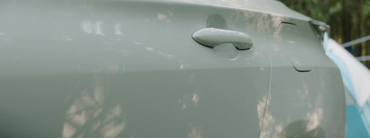 Footage of the outside of a white car