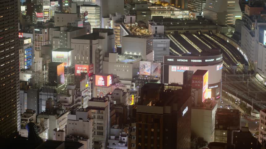 Aerial view of lit up buildings in downtown Tokyo