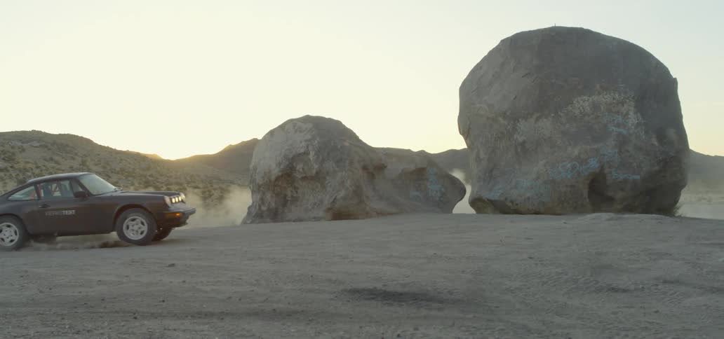 A car spins in the dirt