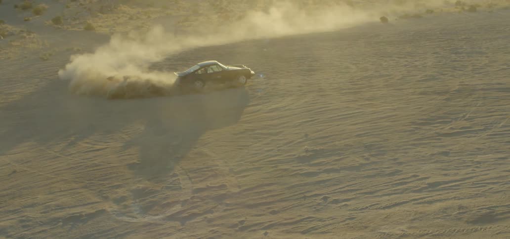 A car spins in the dirt