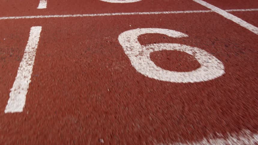 Close up of the numbers painted on a running track