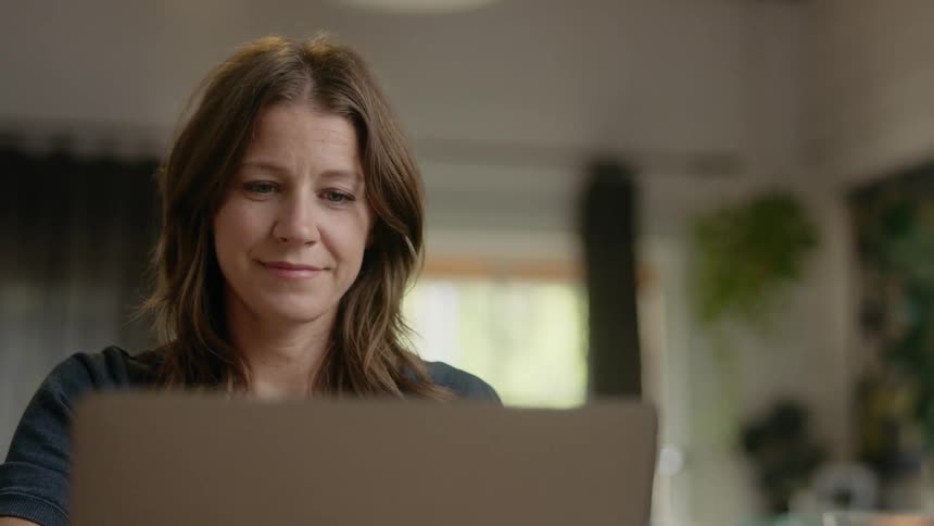 A woman sitting at a laptop