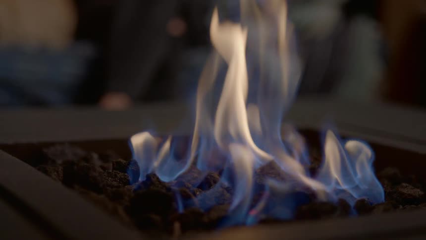 A fire burns in a fire pit