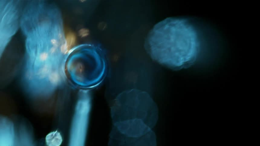 A blue glass flame shimmers and glows