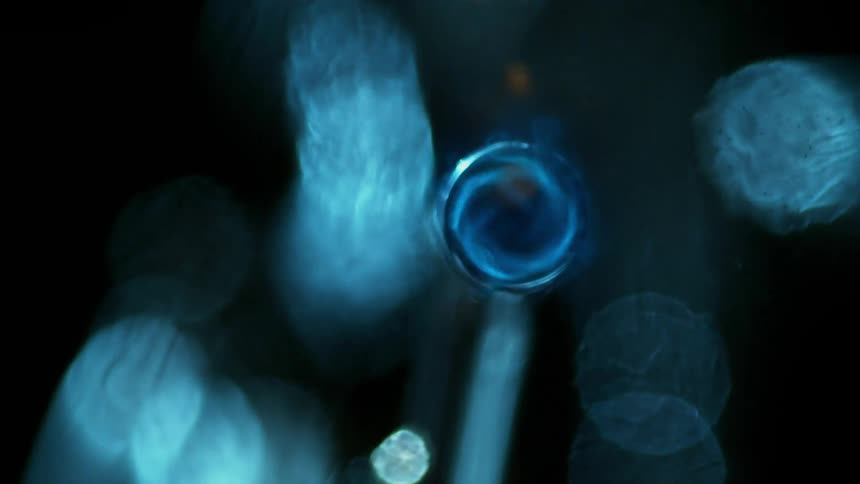 Abstract blue spinning pattern with distorted blue bokeh