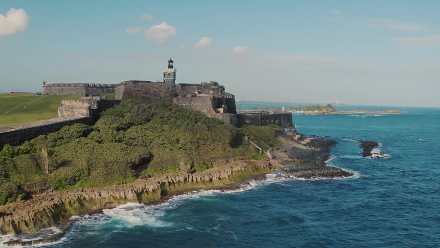 A castle sits on a promontory surrounding by water