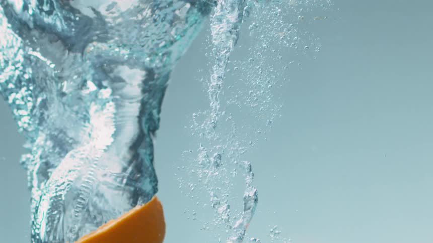 Fruit that is being dropped into some water