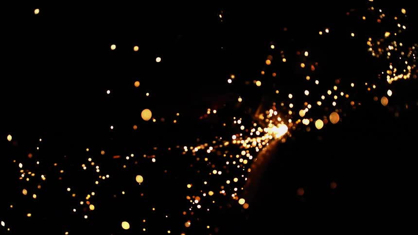 Sparks spray into darkness