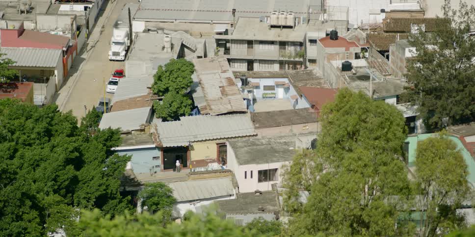 Houses and structures tightly packed in an urban neighborhood