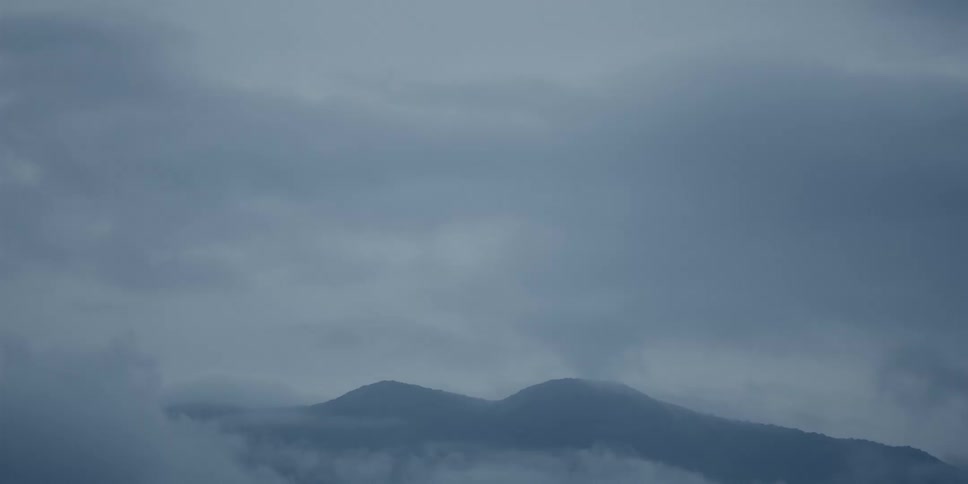 View of mountain ranges on a cloudy day