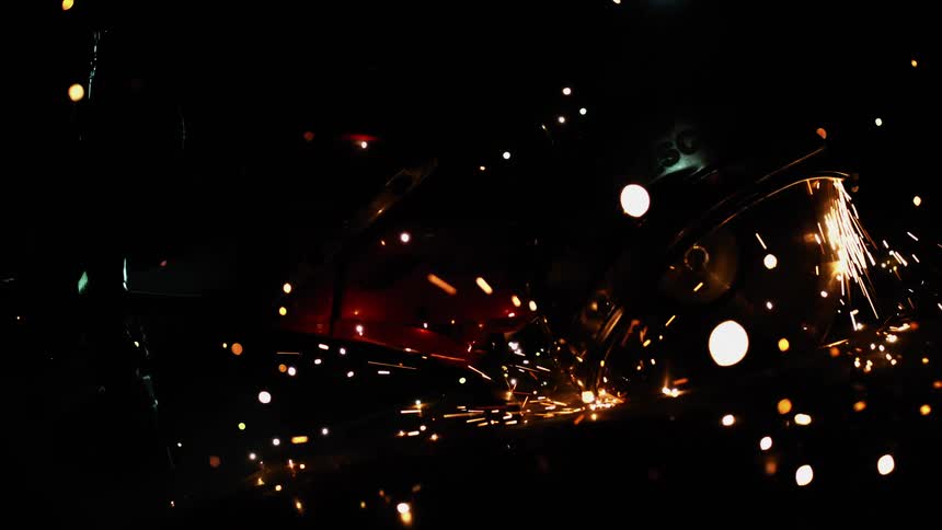 A buzz saw cutting metal and sparking