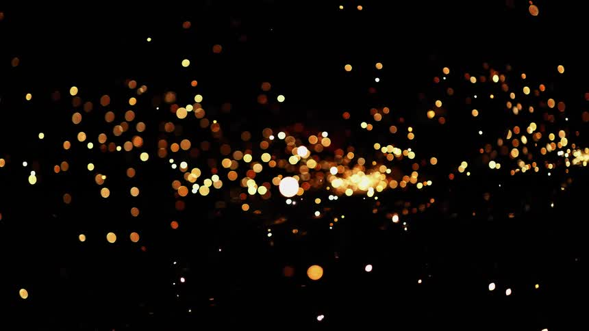 Abstract footage of bright lights moving in darkness