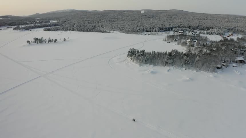 A person riding a bike on a snowy track