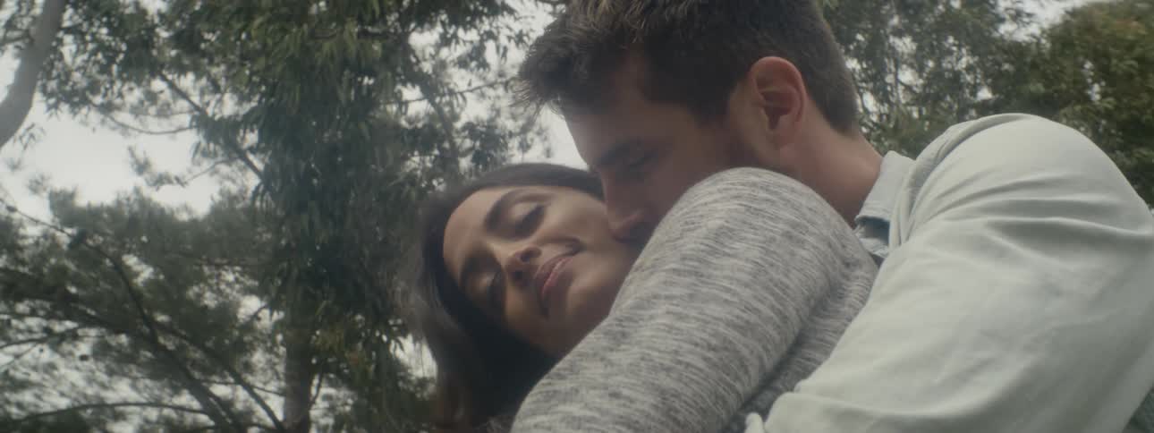 Romantic couple kissing and hugging outdoors