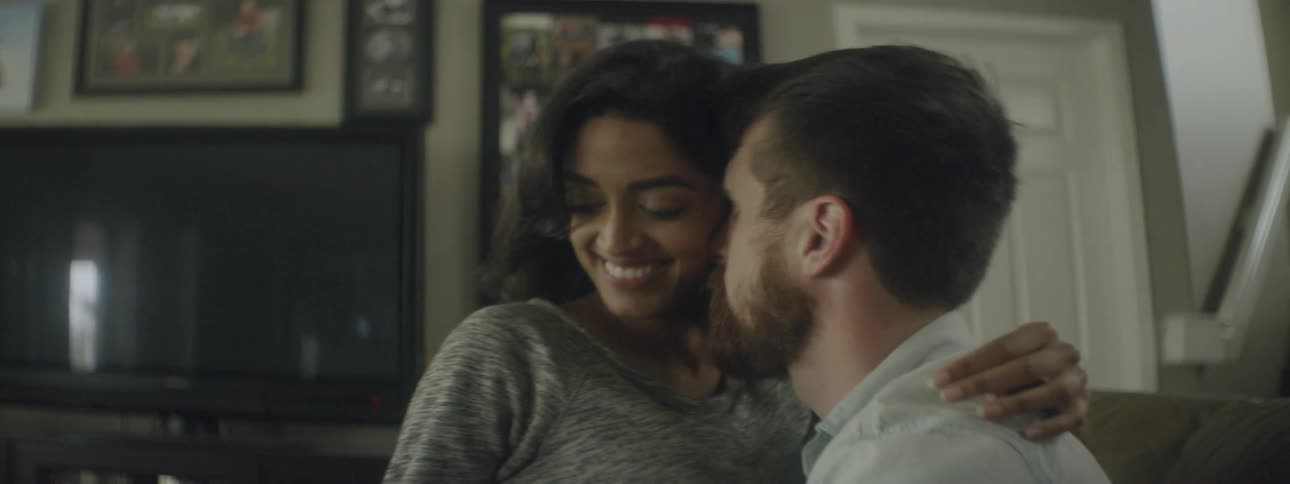 A woman and man hug