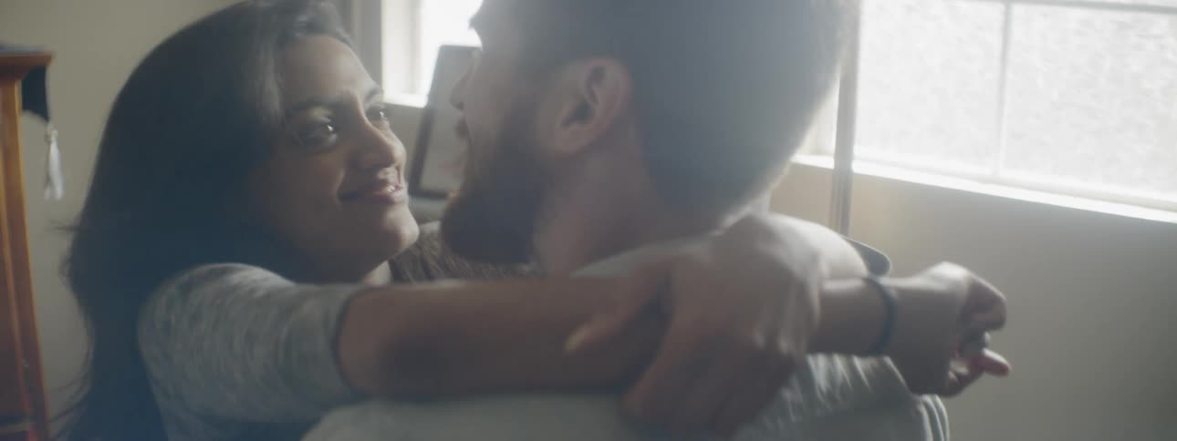 A man and woman hug
