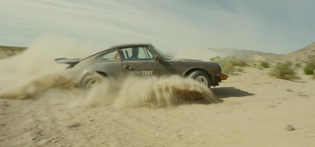 A car spins in the dirt