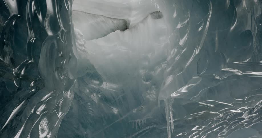Looking at the ceiling in a cave that is made of ice