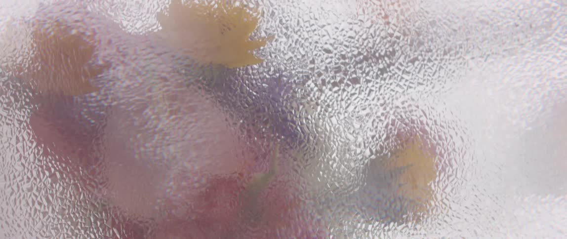 Blurry liquid floats while flashes flash in the background