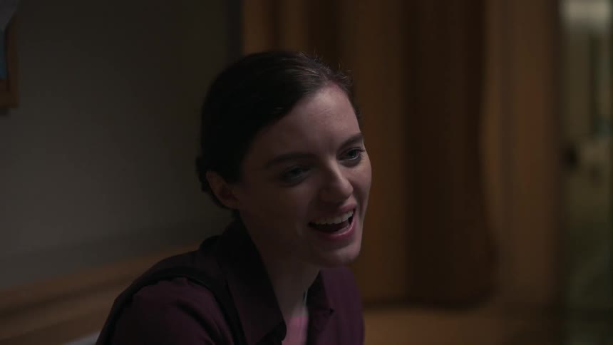A young white woman speaks in an awkward manner