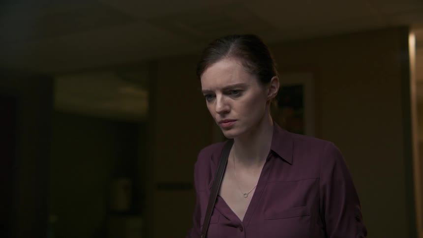 A woman sadly stares