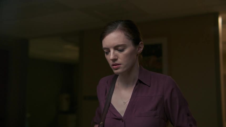 Woman nervously moves back and forth talking in room