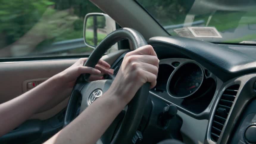 A woman driving in a car