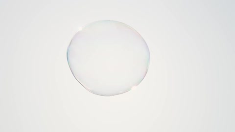A large bubble floats in the sky