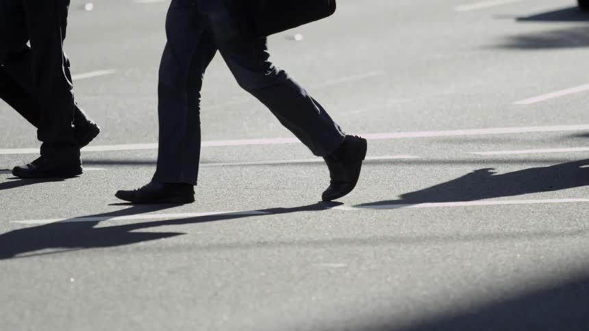 Business people crossing street