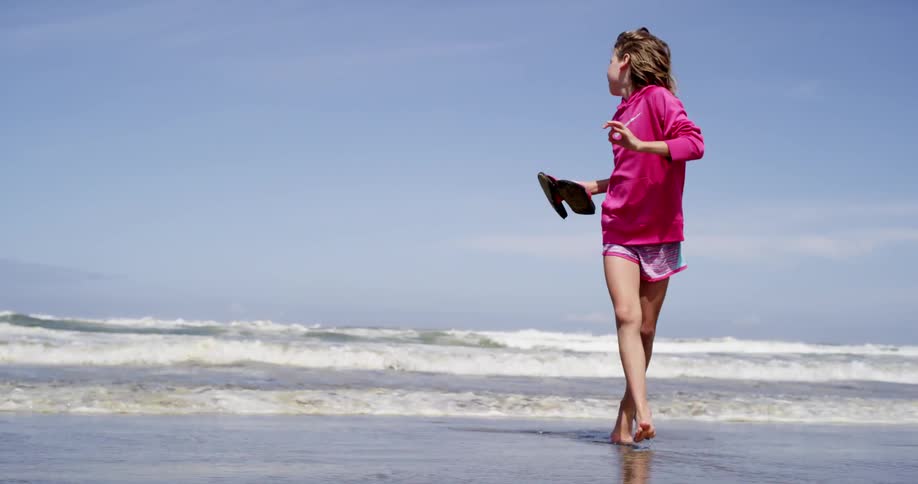 Child runs from waves