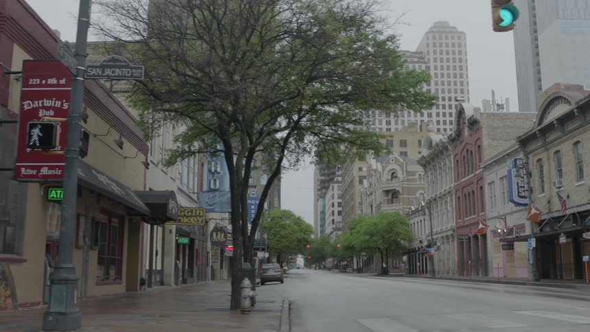 A downtown city is empty of traffic and pedestrians