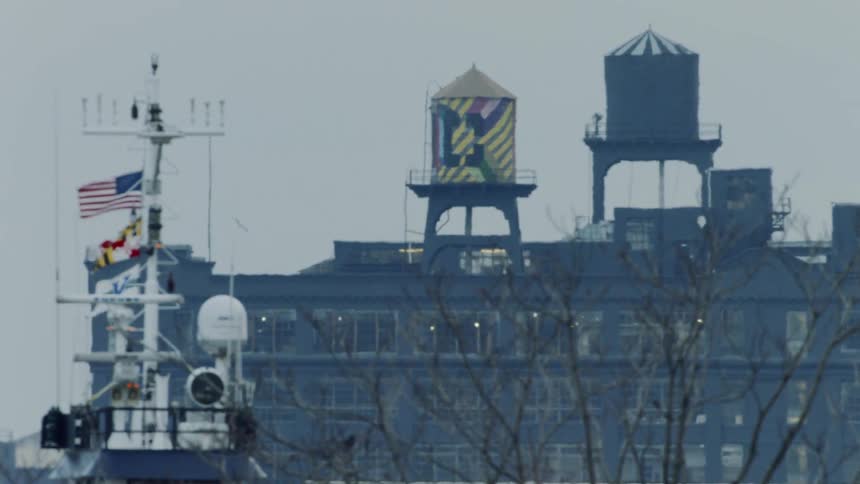 Flags in the breeze outside of a factory