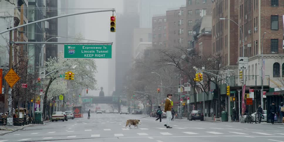 People cross a city street