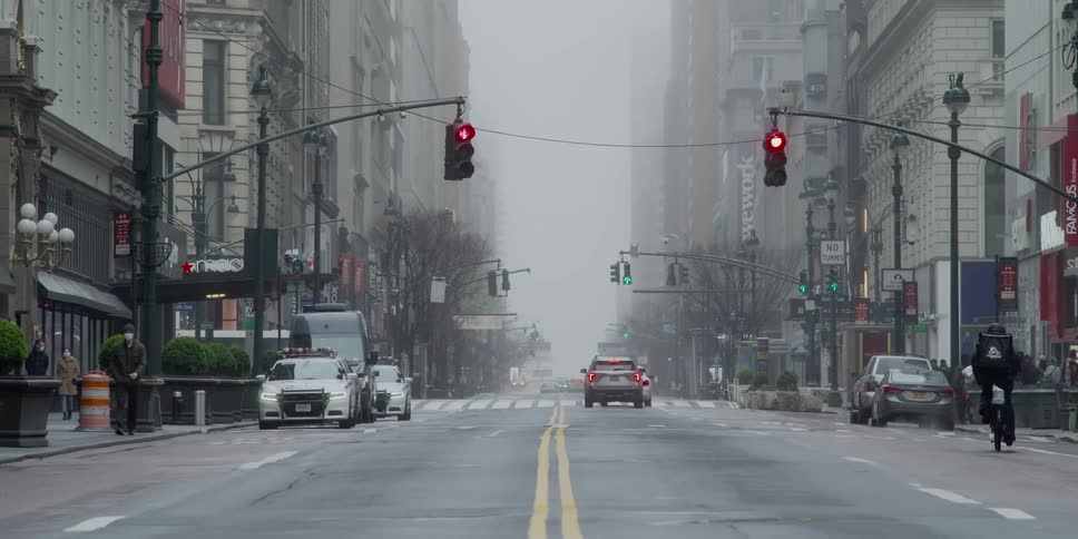 An intersection in a city on a foggy day