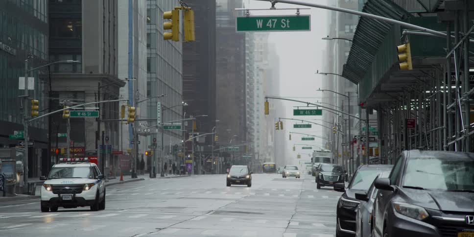 A nearly empty street in new york city on a rainy day