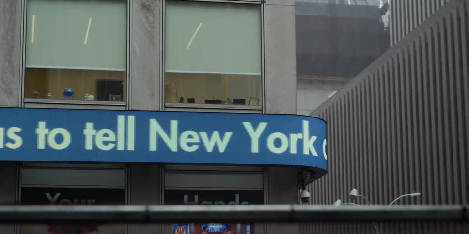 Scrolling news banner on city street corner