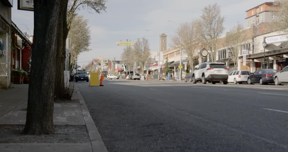 Traffic drives down a neighborhood street