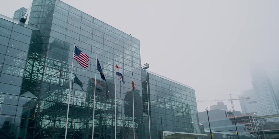 Static shot of a building with flags waving