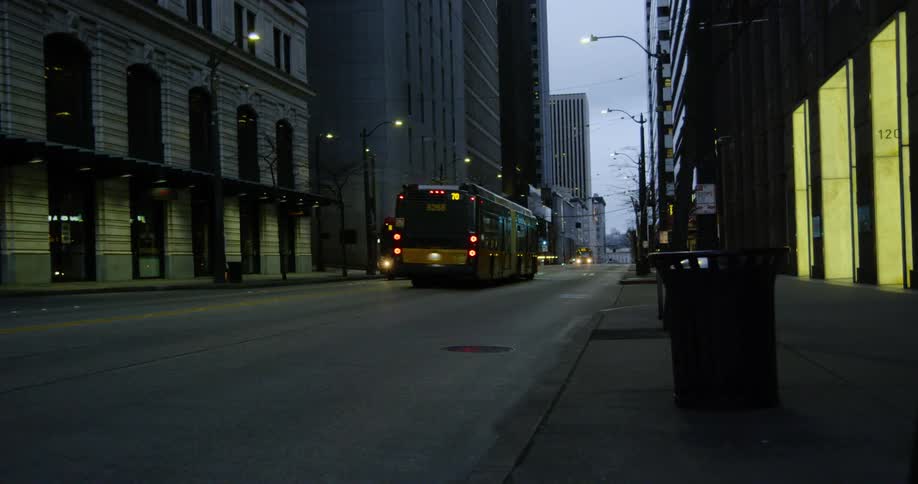 City buses drive at night