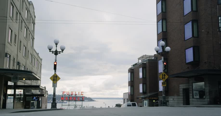 Car passes by an empty intersection in city downtown