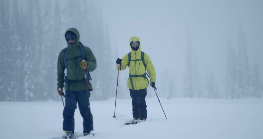 Two people tour on skis