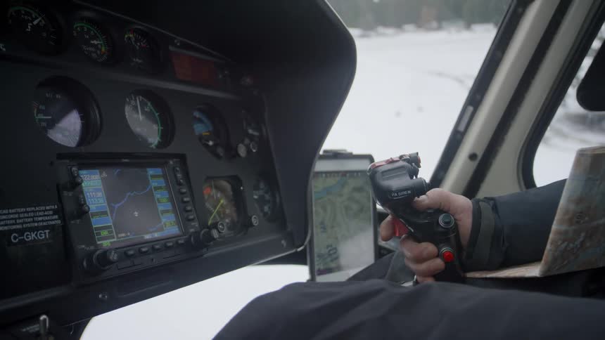 A person flies a helicopter outdoors in winter