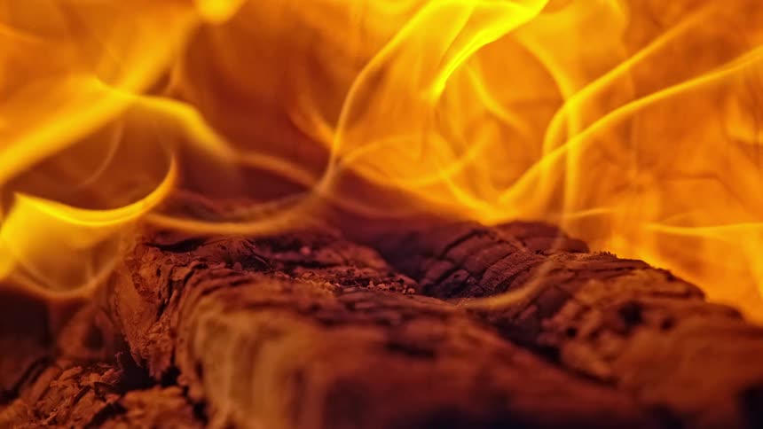 Close up of flames burning heavily on logs