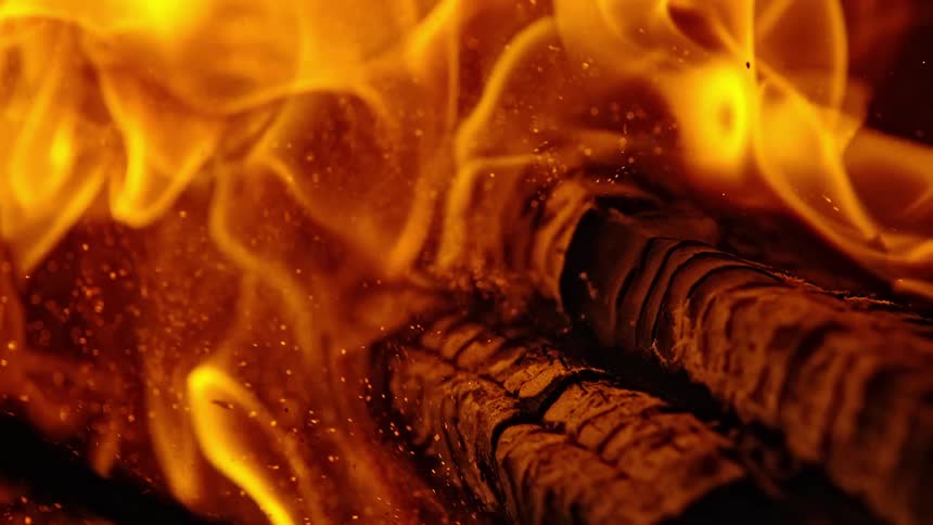 Fire burns a piece of wood