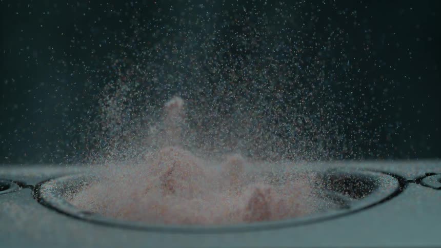 Sand moves on a speaker as the speaker vibrates