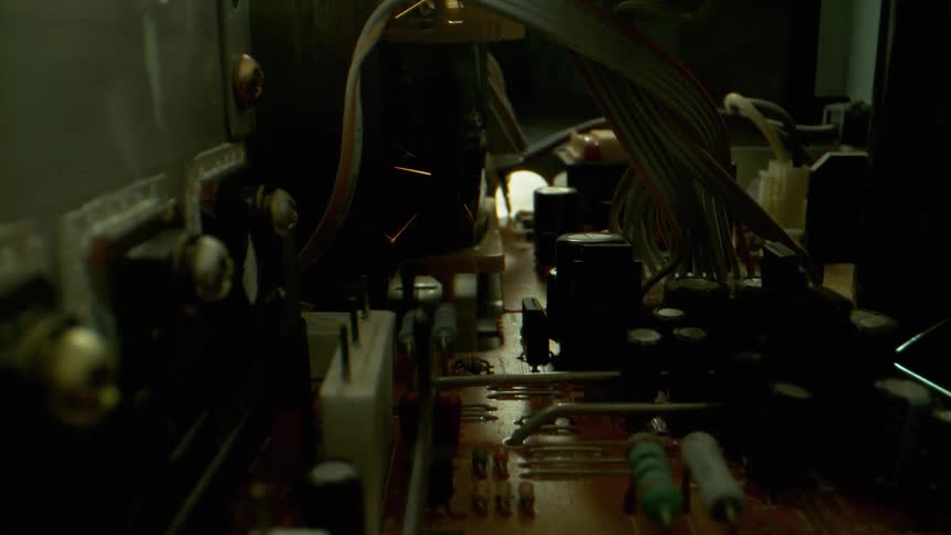 Sparks float into the air over electrical circuit